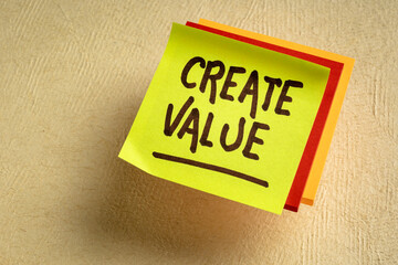 create value reminder or inspirational advice - handwriting on a sticky note, business and personal development concept