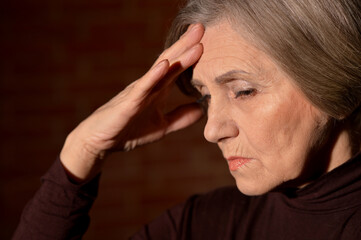 Fototapeta premium Close up portrait of sad senior woman