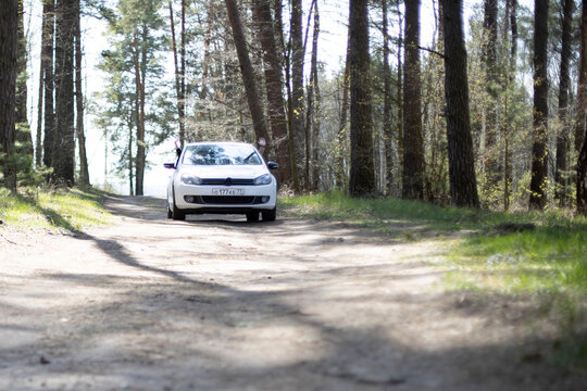 moscow, russia - may 15, 2020: flagship hatchback Volkswagen golf VI white color rides forest road
