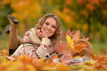 Close up portrait of young woman resting in park