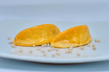 Moroccan pastry, cornes de gazelle.Moroccan biscuit on a white background
