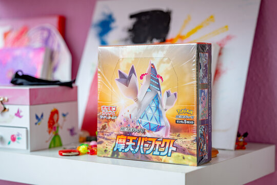 Hamburg, Germany - 08142021: photo of a sealed japanese pokemon Display of the series Towering Perfection standing on child's room shelves.