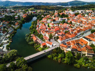 Fototapeta na wymiar Novo Mesto Cityscape at Bend of the Krka River in Slovenia Lower Carniola Region. Aerial Drone View
