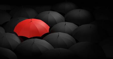 Different, unique and standing out of the crowd red umbrella