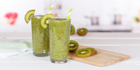 Green smoothie fruit juice kiwi drink in a glass panorama with copyspace copy space