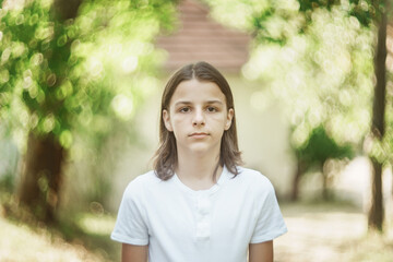 portrait of a boy with long hair