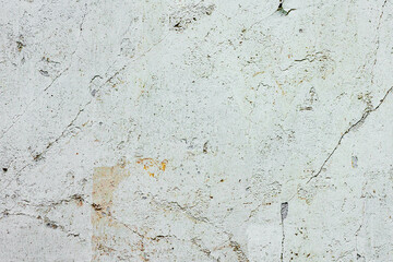 Texture of a concrete wall with cracks and scratches which can be used as a background