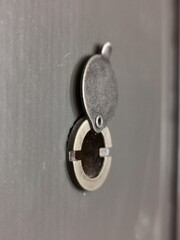 Close-up view of the door peephole.