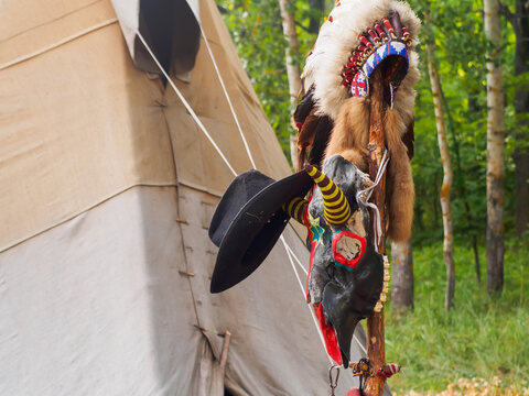 Forest home of the Indians. Wigwam indian teepee. The life of nomadic tribes. The wigwam stands in the forest. A hut of nomadic peoples. A home of Indians. tippi aka in the forest.
