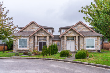 A perfect neighbourhood. Houses in suburb at Fall in the north America. Luxury houses with nice landscape.