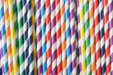 Colorful Striped Paper Straws Background Close up