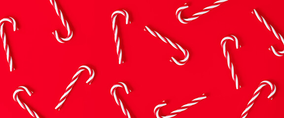 Minimal Merry Christmas poster. Red stripe candy cane on red background. 3d rendering illustration. Clipping path of each element included.