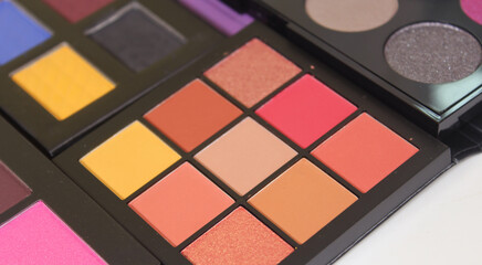 Brightly Colored Cosmetic Pigment Palettes With Various Cosmetics