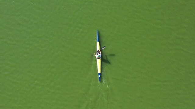 People Kayaking on River. Center for Sports Training in Kayaking and Canoeing. Athletes in Training, City Rowing Canal. Kayak Water Sports. People Boating on River. View from above. Drone shooting 