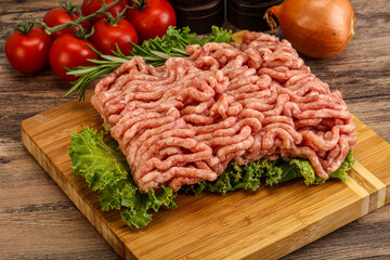 Raw pork minced meat over board