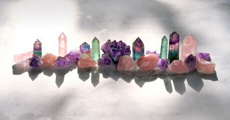 Different Minerals on marble background. Healing stones for Crystal Ritual, spiritual practice. modern magic. Esoteric life balance concept. Set of Fluorite, amethyst, rose quartz. - obrazy, fototapety, plakaty