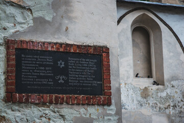 LVIV, UKRAINE - July, 2021: Ruins of Synagogue Golden Rose and memorial plaque.