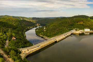Fototapeta na wymiar The Orlik Reservoir on Vltava River is largest hydroelectric dam in Czech Republic. Aerial view to important source of sustainable energy in European Union.