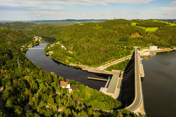 The Orlik Reservoir on Vltava River is largest hydroelectric dam in Czech Republic. Aerial view to important source of sustainable energy in European Union. - obrazy, fototapety, plakaty