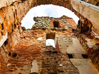 
an old church, bombed by the Soviet army, has only walls left
