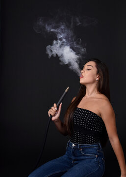 Beautiful and sexy girl smokes hookah, sheesha. Sexy woman smoking. The  pleasure of smoking. Stock Photo | Adobe Stock