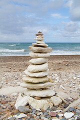 Fototapeta na wymiar Stone tower made of chalk rock on the beach