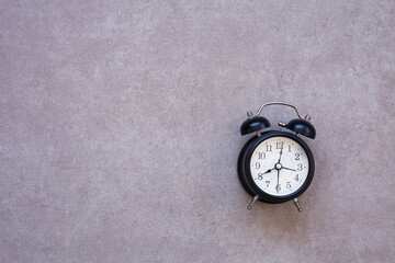 alarm clock on gray background,isolated 