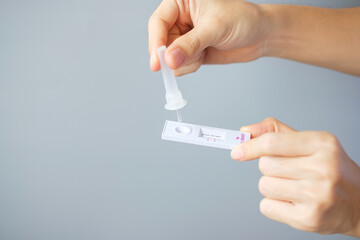 man swab COVID-19 testing by Rapid Antigen Test kit. Coronavirus Self nasal or Home test, Lockdown and Home Isolation concept