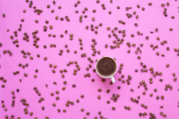 Turkish coffee and coffee beans on a pink background
