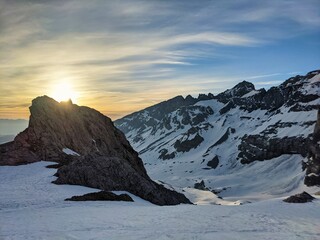 Ski tour at sunrise, Ski mountaineering ski touring on a mountain peak in the swiss alps. Clariden. Glarus uri. Winter - obrazy, fototapety, plakaty