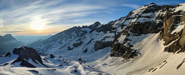 Ski mountaineering with a breathtaking panorama of the snowy mountains.Ski tour on the Clariden mountain.Sunrise Glarus - obrazy, fototapety, plakaty