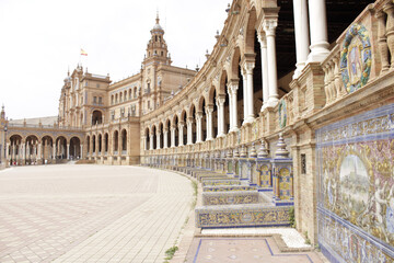 Closeup of the ornate facade of Plaza de Espana against a bright sky