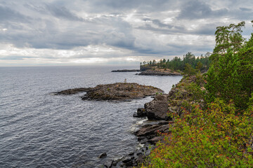 Fototapeta na wymiar View of the rocky coast of Valaam island on a cloudy day