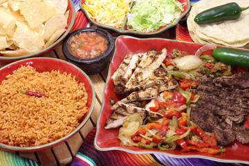 Beef and Chicken Fajita Dinner With Rice and Tortillas in Rustic Setting