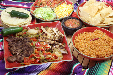 Beef and Chicken Fajita Dinner With Rice and Tortillas in Rustic Setting