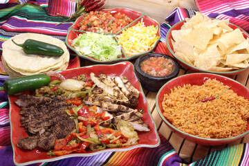 Beef and Chicken Fajita Dinner With Rice and Tortillas in Rustic Setting