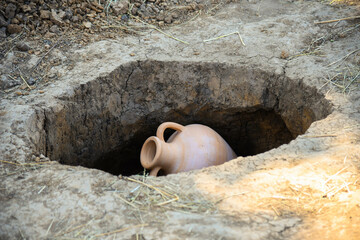 BILSK, UKRAINE – 14 AUGUST 2021: Clay amphora lies on the ground during the historical festival «Gelon Fest»
