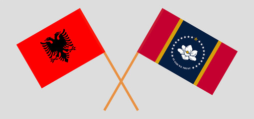 Crossed flags of Albania and the State of Mississippi. Official colors. Correct proportion