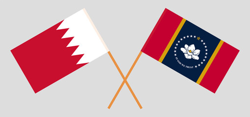 Crossed flags of Bahrain and the State of Mississippi. Official colors. Correct proportion