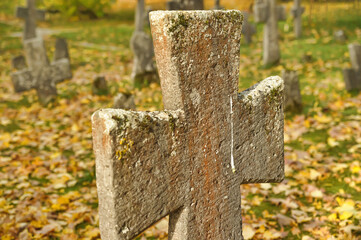 Stone crosses in the old cemetery in autumn