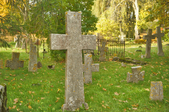 Stone crosses in the old cemetery in autumn