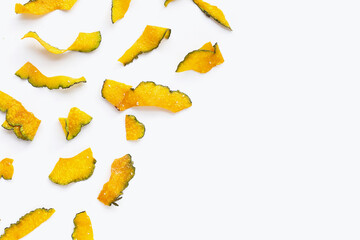Naklejka premium Green pumpkin slice chips on white background.