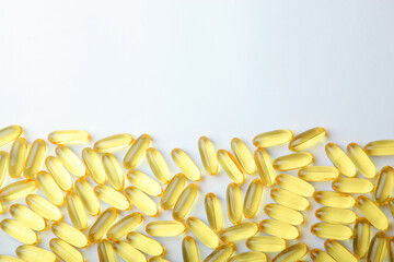 Omega 3 capsules on a white background with place for text.