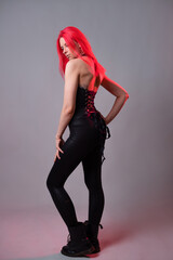 Kitsch style, fashion of the future. mixing styles. A young woman