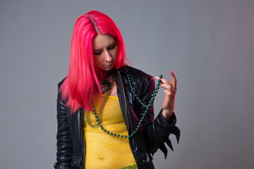 Futuristic fashion, a young bright and attractive woman with pink hair,