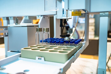 Pharmaceutical production. Production line with test tubes. Concept - production of pharmaceuticals. Manufacturing of medicines. Equipment for modern medical laboratory. Pharm manufacturing