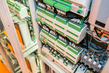 engineering concept. Electrical cabinet with many automatic machines. Electrical equipment close-up. Power control panel. Electrification equipment. Power switches with many wires.