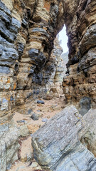 Arch at Blighs Rocks Bruny Island Tasmania Through rocks on the Beach