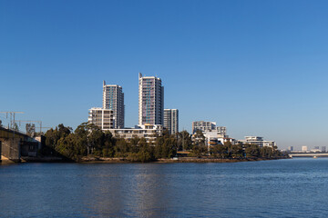 Fototapeta na wymiar Rhodes apartment building waterfront, Sydney, Australia.