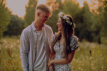 portrait photo of a young couple at sunset. a couple in love together